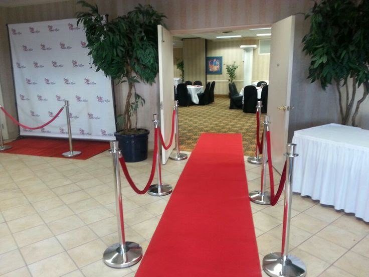 Chrome Stanchions with Red Velvet Ropes and Red Carpet